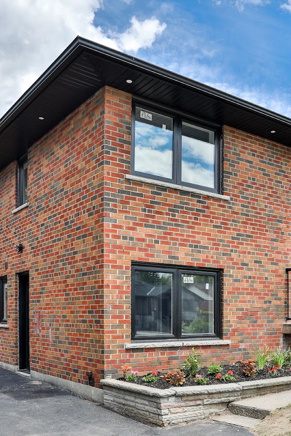 Two-storey home addition, brick exterior, Vanguard Build